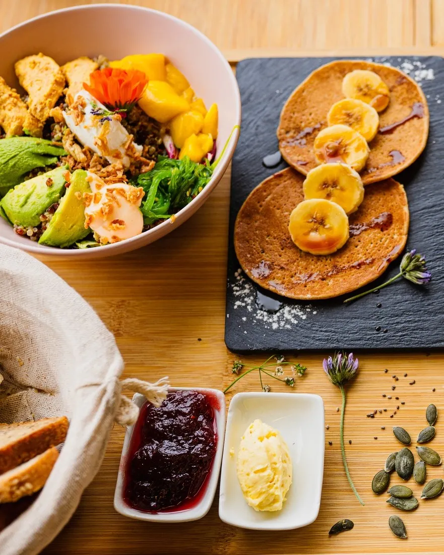 Full breakfast served on a wooden board