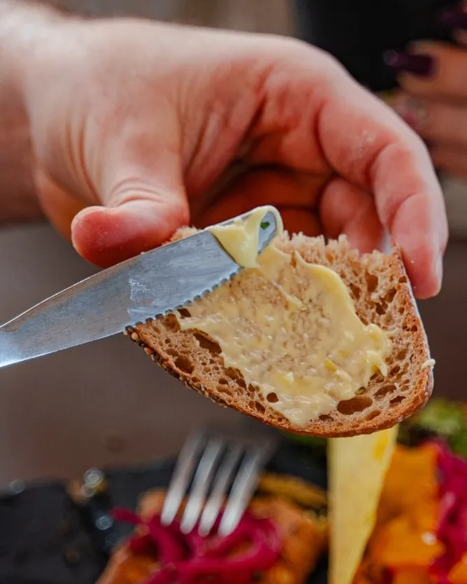 Slice of artisan bread with seasoned margarine