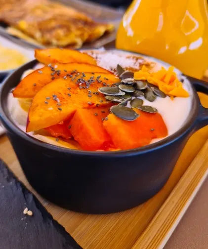 Natural yoghurt with fresh fruit and seeds